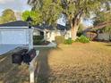 Well-maintained home featuring lush landscaping, attached garage, and clearly visible street numbers at 6767 Sw 114Th Street Rd, Ocala, FL 34476