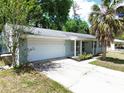 Charming single-story home with attached garage and well-manicured landscaping and a classic, neutral color palette at 736 Ne 26 Ter, Ocala, FL 34470