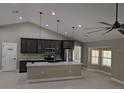 This open kitchen features stainless appliances, granite counters, and large center island at 6150 Sw 123 Ave Rd, Dunnellon, FL 34432