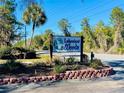 Welcoming entrance sign to Lakeview Woods community featuring lush landscaping and brick accents at 845 Ne 130 Ter, Silver Springs, FL 34488