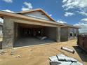 A new home under construction shows the garage and CMU block walls, and lumber framing at 4528 Sw 90Th Lane Rd, Ocala, FL 34476