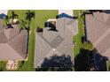 Overhead view showcasing a well-maintained roof with clean lines and a neatly kept surrounding yard at 13968 Se 96Th Cir, Summerfield, FL 34491