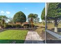 Manicured backyard with decorative landscaping and stone walkway, enhancing outdoor appeal at 8968 Sw 98Th Ave, Ocala, FL 34481