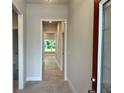 Inviting entryway featuring neutral walls and a tile floor, creating a clean and welcoming space at 4504 Sw 90Th Lane Rd, Ocala, FL 34476