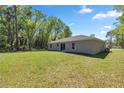 Large backyard with a lush green lawn, perfect for outdoor activities at 4585 Se 136Th St, Summerfield, FL 34491