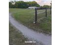 Expansive property featuring fenced land, mature trees, and a home in the distance at 10750 Nw 7Th St, Ocala, FL 34482