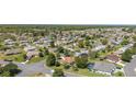 An aerial view of a tranquil residential neighborhood, showcasing the area's lush greenery and serene atmosphere at 13805 Se 87Th Ter, Summerfield, FL 34491