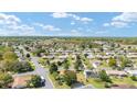 An aerial shot of a residential area, revealing the orderly layout and landscaping of the community at 13805 Se 87Th Ter, Summerfield, FL 34491