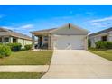 Charming single-Gathering home featuring a two-car garage and landscaped front yard at 29496 Caspian St, Leesburg, FL 34748