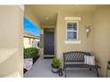 Cozy front porch area with seating and charming decor at 29496 Caspian St, Leesburg, FL 34748