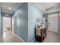 Hallway with a small table and view to the bedrooms at 29496 Caspian St, Leesburg, FL 34748