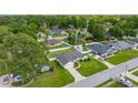 An aerial perspective showing the house nestled among mature trees in a peaceful neighborhood at 3203 Se 23 Ter, Ocala, FL 34471