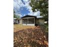 Backyard featuring a screened-in porch and a chain-link fence at 333 Marion Oaks Dr, Ocala, FL 34473