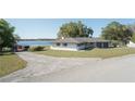Charming single-story home with a two-car garage and a well-maintained lawn at 390 Sw Shorewood Dr, Dunnellon, FL 34431