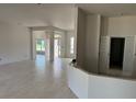 Spacious, light-filled living room with ceramic tile floors, freshly painted walls, and lots of natural light at 71 Nw 42Nd Pl, Ocala, FL 34475