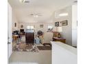 Bright and spacious living room featuring vaulted ceilings, comfortable seating, and a neutral color palette at 8216 Sw 60Th Ter, Ocala, FL 34476