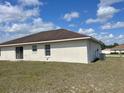 Back exterior featuring siding doors and windows at 8386 Sw 136Th Pl, Ocala, FL 34473