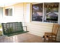 Relaxing porch with a comfortable swing, overlooking the yard at 8569 Sw 92Nd Ln # B, Ocala, FL 34481