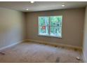 Bright bedroom featuring a large window that fills the room with natural light, enhancing the space at 2218 Nw 23Rd Loop, Ocala, FL 34475