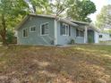 Well-maintained single-story home with blue siding and updated windows at 10955 Sw 89Th Ave, Ocala, FL 34481