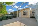 Enclosed patio offering an outdoor living space with a view of the backyard at 11645 Sw 75Th Cir, Ocala, FL 34476