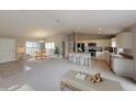 Open-concept living space with a kitchen island, dining area, neutral decor, and modern finishes at 1698 Ne 161 St, Citra, FL 32113