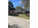 Charming home with mature trees and a well-manicured lawn at 19903 Sw 97Th Ln, Dunnellon, FL 34432