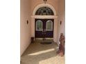 Inviting front entry with a decorative double-door and unique accents at 19903 Sw 97Th Ln, Dunnellon, FL 34432