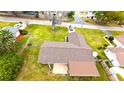 An aerial view displays the house's layout, roof, patio cover, and yard at 2146 Ne 10Th St, Ocala, FL 34470