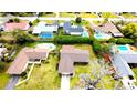 An aerial view showcases the house and neighboring properties, highlighting nearby swimming pools at 2146 Ne 10Th St, Ocala, FL 34470