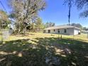 Spacious backyard with a chain-link fence, perfect for outdoor activities at 416 Marion Oaks Crse, Ocala, FL 34473