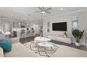Open living room showcasing an modern sofa, stylish rug, and seamless transition to the well-equipped kitchen at 5567 Nw 45Th Ln, Ocala, FL 34482