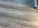 Close-up of luxury vinyl plank flooring with a natural wood grain finish at 6082 Sw 104Th St, Ocala, FL 34476