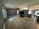 Bright living room with an open floor plan, gray walls, bar top, and luxury vinyl plank flooring at 6082 Sw 104Th St, Ocala, FL 34476
