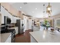 Bright, open kitchen with stainless steel appliances and a large island at 6890 Sw 128Th Pl, Ocala, FL 34473
