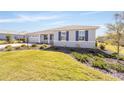 Well maintained single-story home with symmetrical landscaping, manicured lawn and tasteful shrubbery at 8218 Sw 92Nd Cir, Ocala, FL 34481