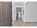 Bright foyer featuring hardwood floors and an open floor plan leading to the living spaces at 9312 Sw 58Th Cir, Ocala, FL 34476
