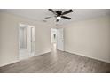 Bright main bedroom with en-suite bathroom and wood-style flooring at 14390 Sw 30 Pl, Ocala, FL 34481