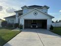 Two-story home features an attached garage and a well-maintained lawn at 4853 Sw 53Rd Rd, Ocala, FL 34474