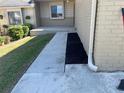 Home's inviting walkway leads to the entrance, complemented by fresh mulch and lush greenery at 5024 Se 109Th St, Belleview, FL 34420