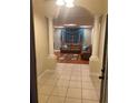 Inviting living room featuring tile entry, columns and decorative drapery at 5323 Sw 111Th Lane Rd, Ocala, FL 34476