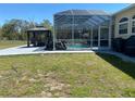 A screened-in pool with a gazebo and plenty of outdoor space at 5323 Sw 111Th Lane Rd, Ocala, FL 34476