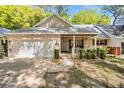 Charming single-story home with brick accents, a two-car garage, and a welcoming front porch at 8683 Sw 93Rd Ln # D, Ocala, FL 34481