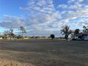 Expansive parcel of land with sparse tree coverage under a bright sky at 8232 Fairways Cir # D101, Ocala, FL 34472