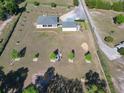 Aerial view of home with spacious grounds including a big yard, and long driveway at 11395 Se 108Th Terrace Rd, Belleview, FL 34420