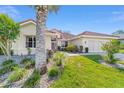 Charming single-story home with tropical landscaping and a well-manicured lawn at 11427 Sw 82Nd Ave, Ocala, FL 34481