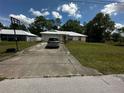 Well-maintained single-story home, driveway and green lawn in a quiet neighborhood at 15115 Se 94Th Ct, Summerfield, FL 34491