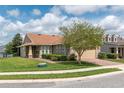 Attractive single-Gathering home featuring a well-manicured lawn, tidy landscaping, and a convenient two-car garage at 4945 Nw 35Th Lane Rd, Ocala, FL 34482