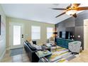 Well-decorated living room featuring stylish furniture, a modern accent wall, and an inviting atmosphere at 5770 Sw 89Th Pl, Ocala, FL 34476