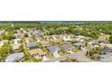 Residential neighborhood showcasing single-story homes, mature trees, and nearby lake at 9290 Se 120Th Loop, Summerfield, FL 34491